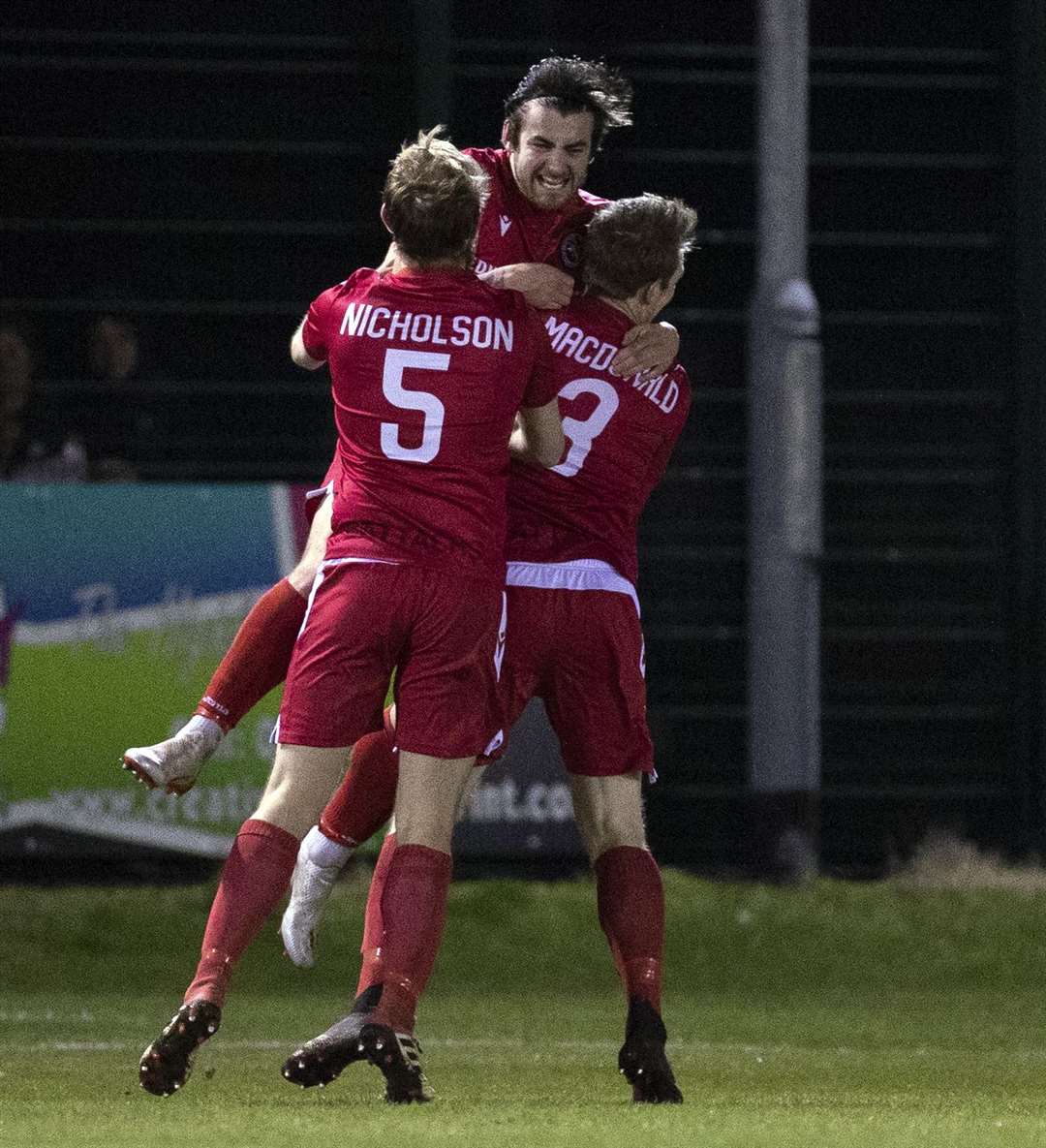 Jordan Macrae takes the acclaim of team-mates after his opener for Brora Rangers against Hearts. Picture: Ken Macpherson