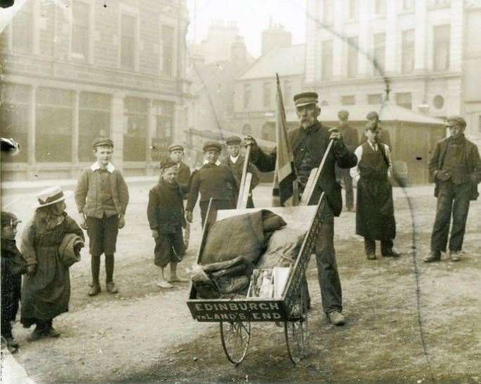 Bob Carlisle pushing his wheelbarrow through Wick town centre. Picture: The Wick Society