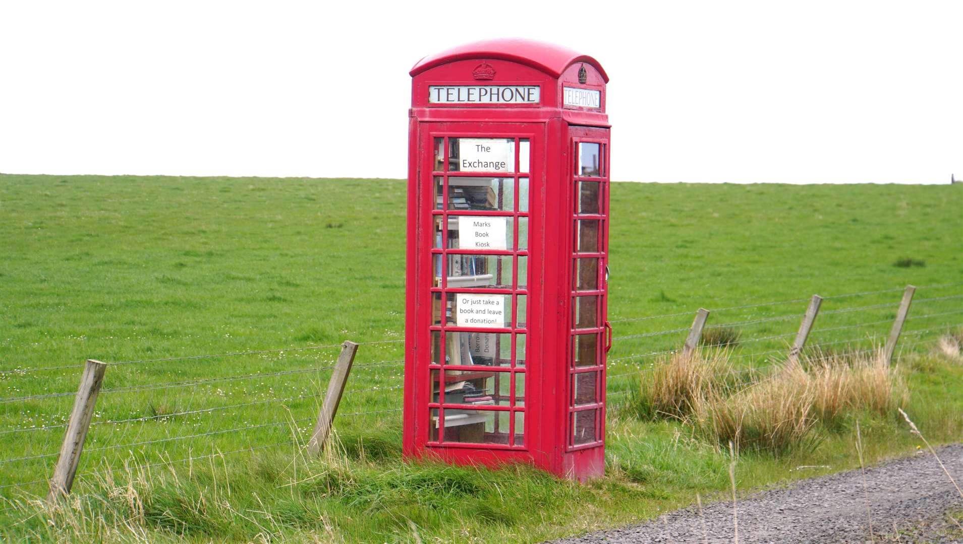 This classic telephone box in the Scarfskerry area is now used as a local book exchange. Will other phone boxes in Caithness go the same way? Picture: DGS
