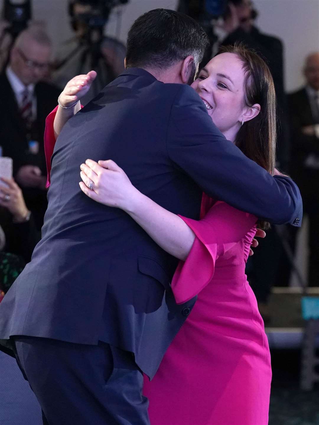 Humza Yousaf hugs rival Kate Forbes after it was announced that he is the new Scottish National Party leader (Andrew Milligan/PA)