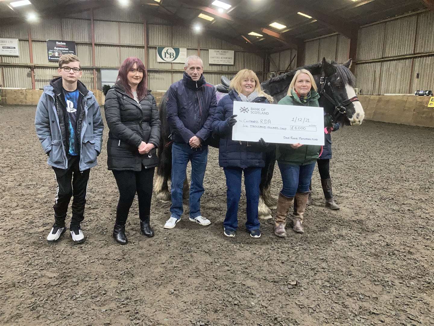 John and Heather Rosie present a cheque for £6000 from the Dale Rosie Memorial Fund to group chairperson Judith Miller. Also in the picture are Claire Fraser and her son Rory (left|).