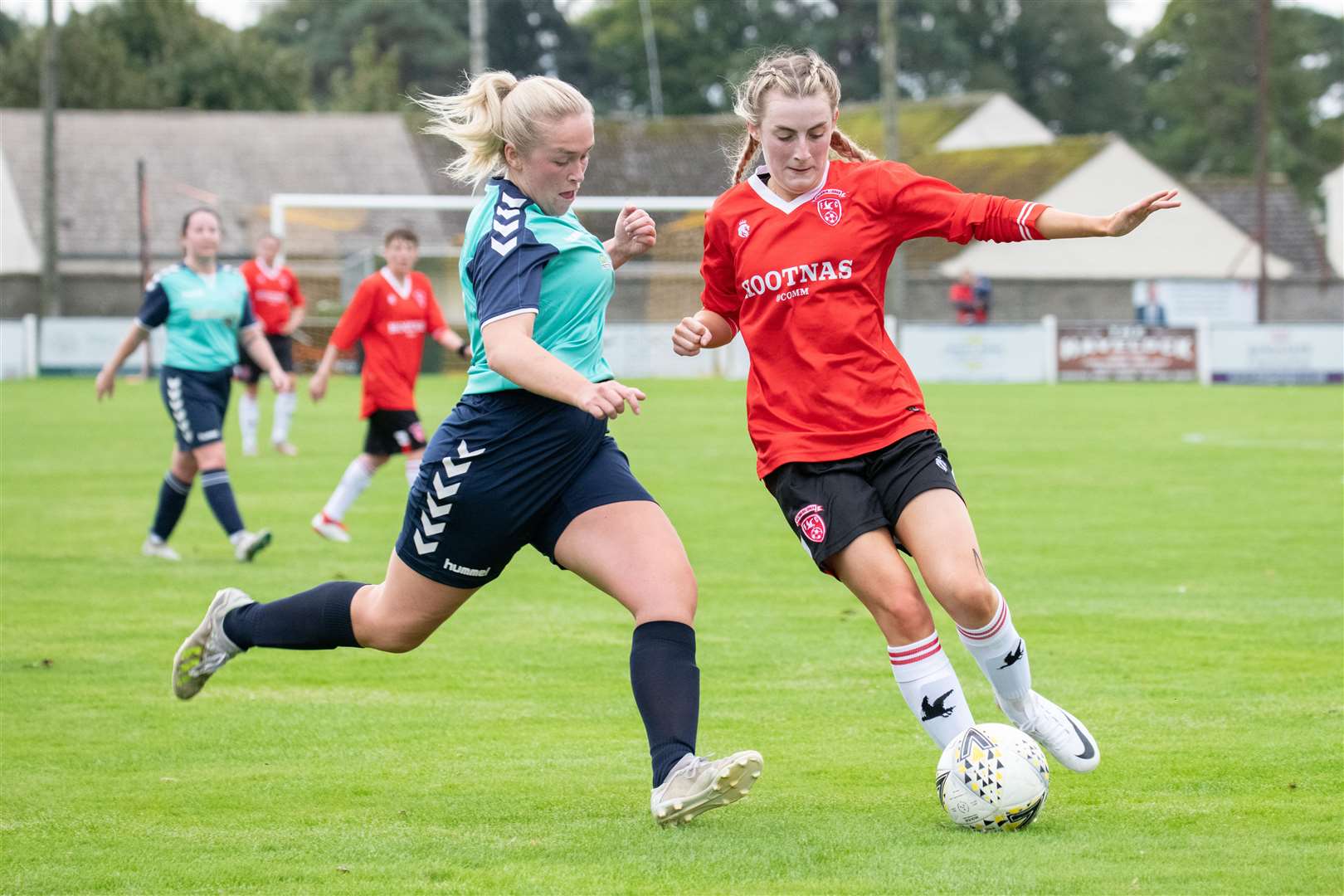 Buckie's Emily McAuslan closes in on Bethin MacDonald. Picture: Daniel Forsyth