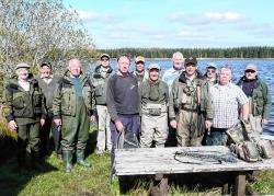 The anglers lined up by Loch Toftingall for the Dounreay Fly Fishing Association competition.