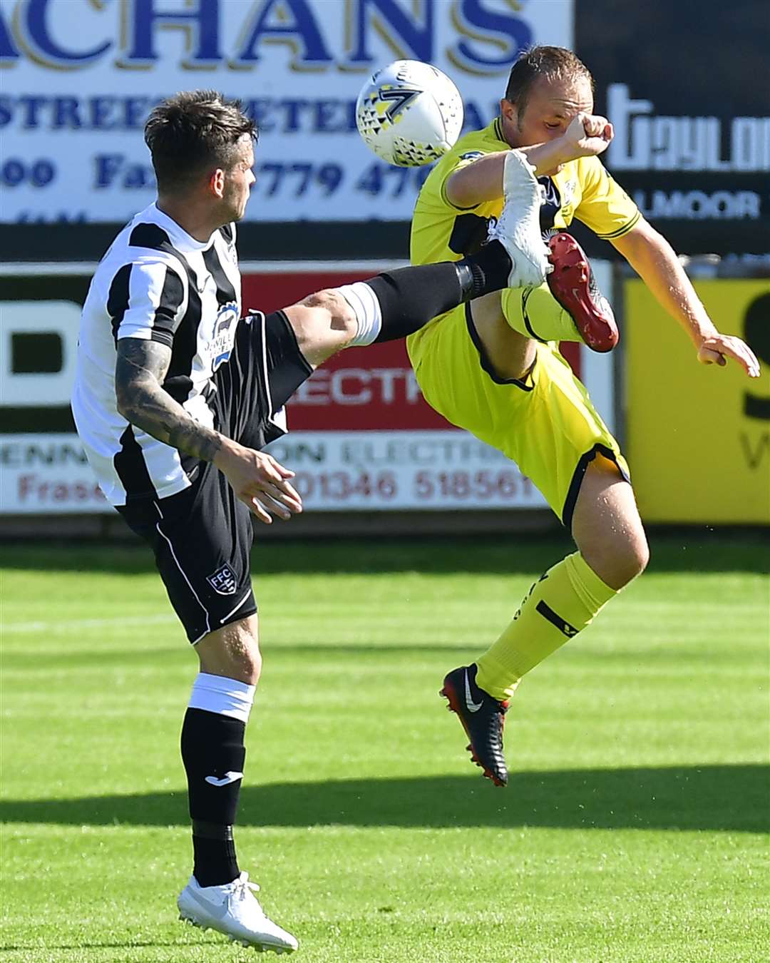 Fraserburgh's Ryan Cowie and Wick's Richard Macadie. Picture: Mel Roger