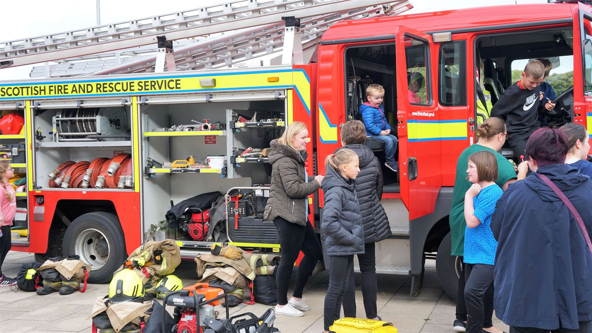Many children enjoyed clambering on board the fire engine at the front of the school. Picture: DGS