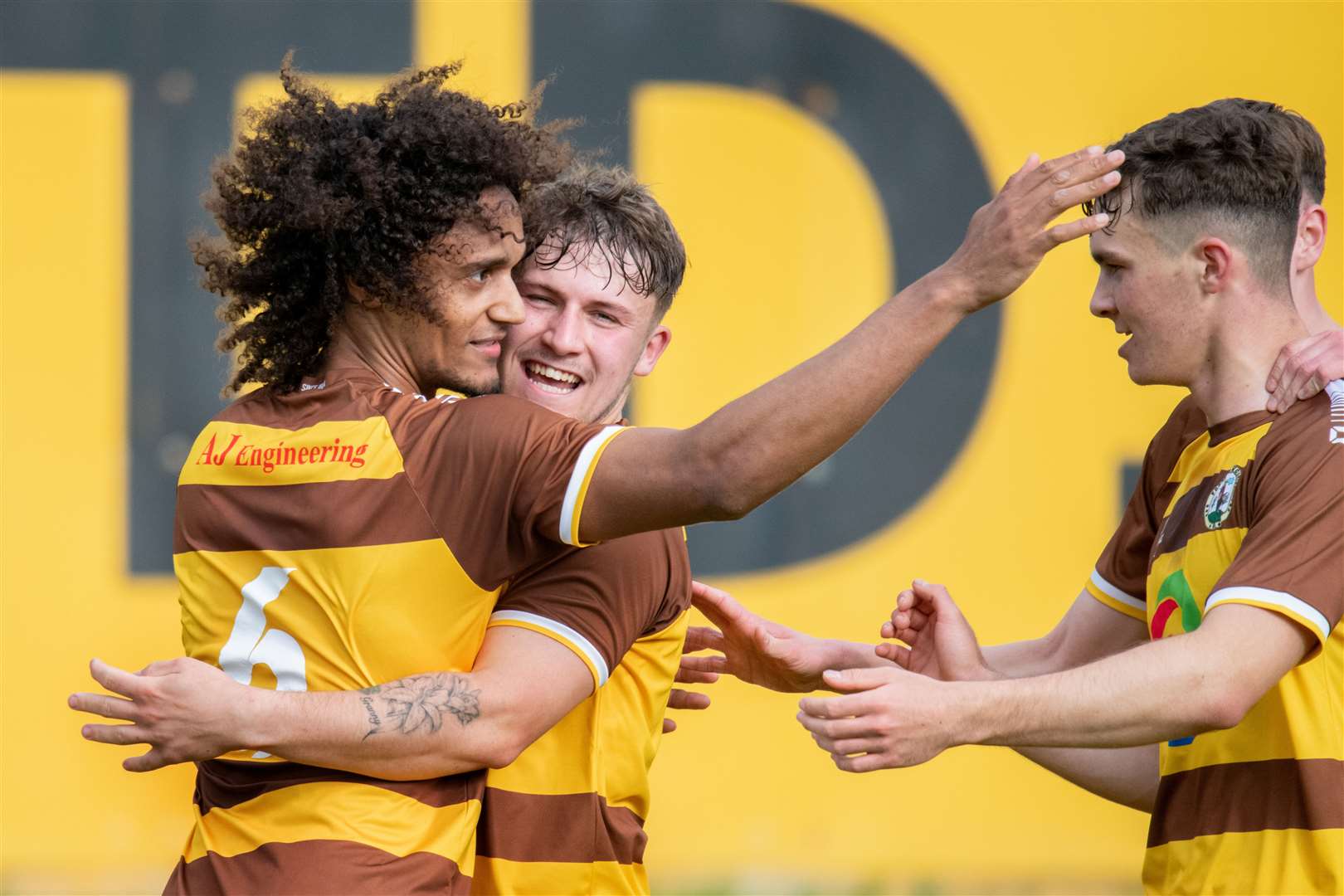 Jordan Alonge takes the acclaim after putting Forres Mechanics 2-1 up against Wick Academy at Mosset Park. Picture: Daniel Forsyth