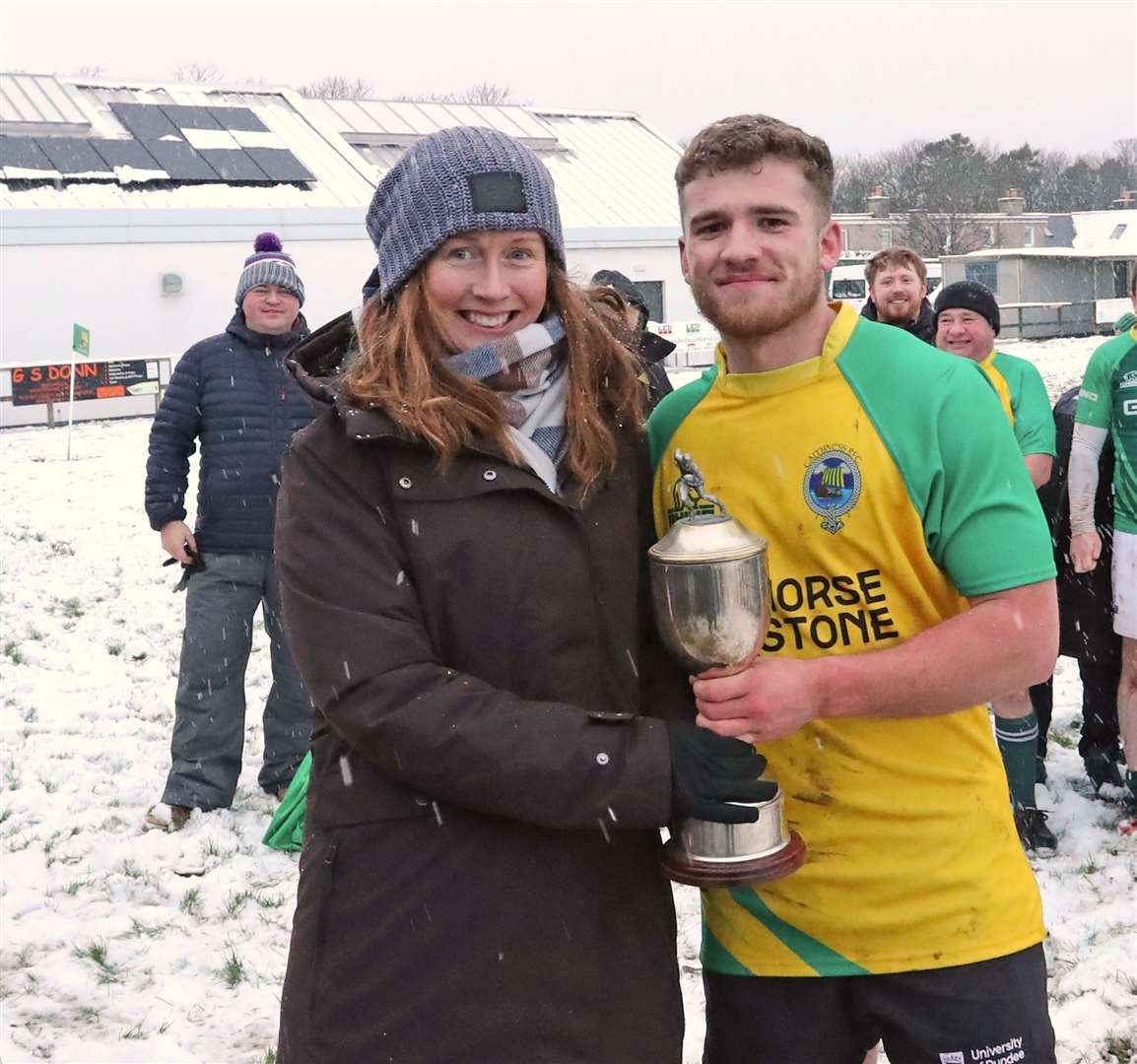 On behalf of the Cadzow family, Nicola Mill presents the Sinclair Cadzow Memorial Cup to the Exiles' captain Stuart Kirk. Picture: James Gunn