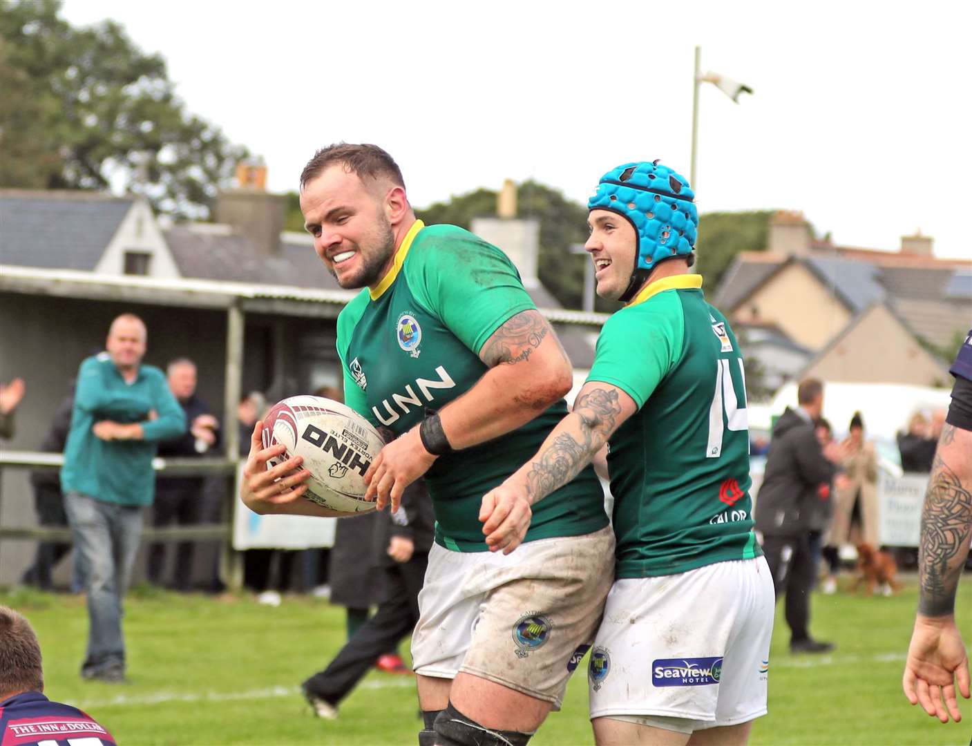 Grant Anderson (left) is congratulated by Cameron Ryder after scoring a try in a 27-12 victory over Hillfoots at Millbank in September. Picture: James Gunn