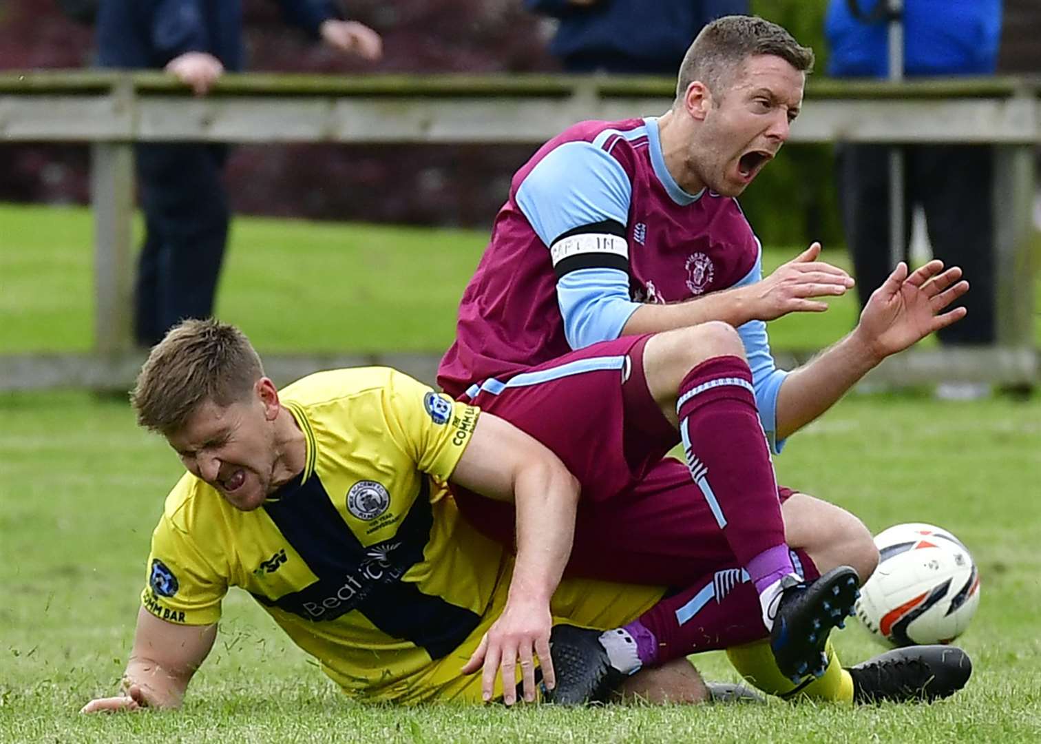 Nairn St Ninian's Keith Mason feels the force of a Michael Steven challenge during a pre-season friendly last year. Picture: Mel Roger