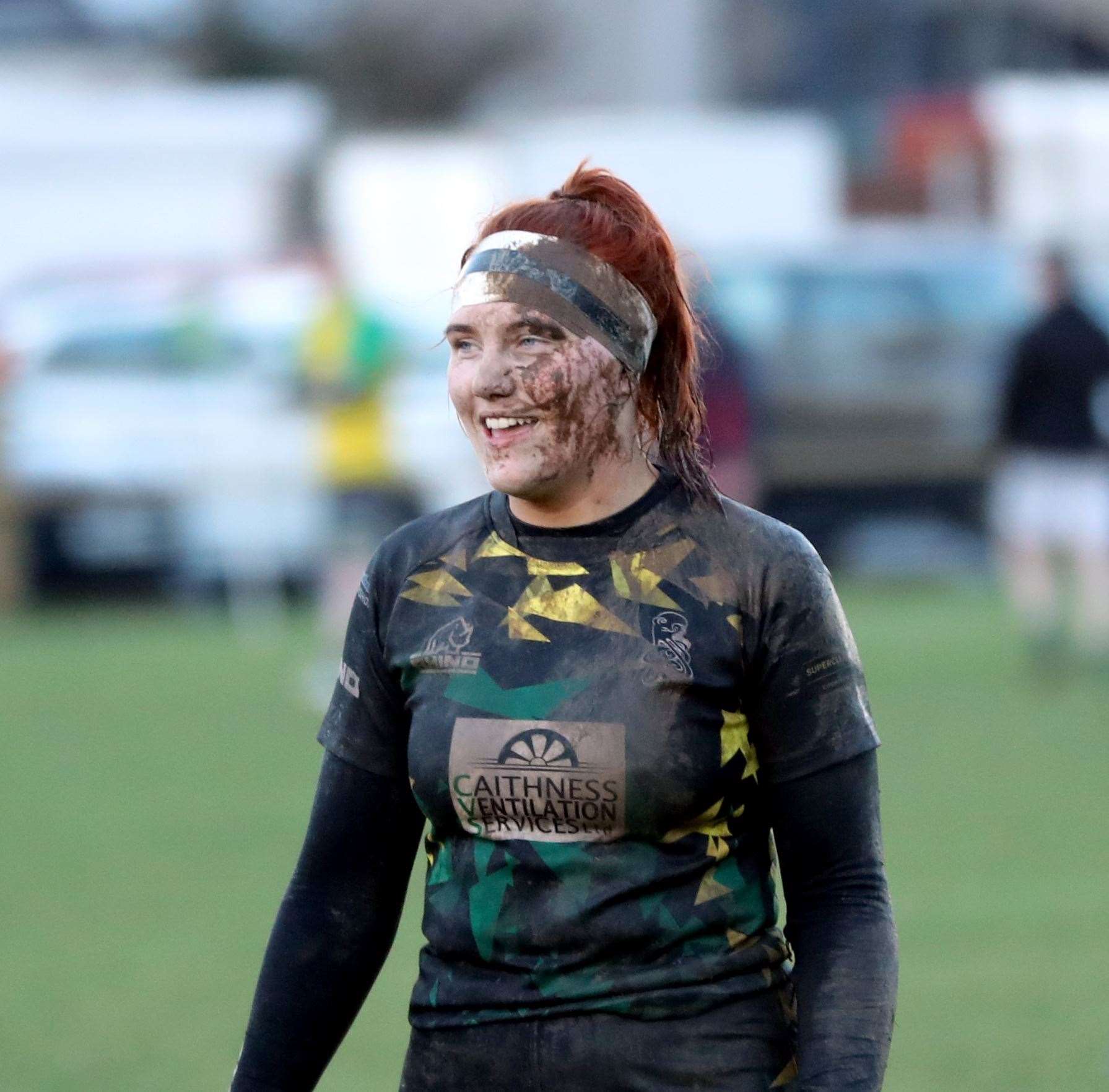 A mud splattered Ellie Anderson takes a breather at the break. Picture: James Gunn