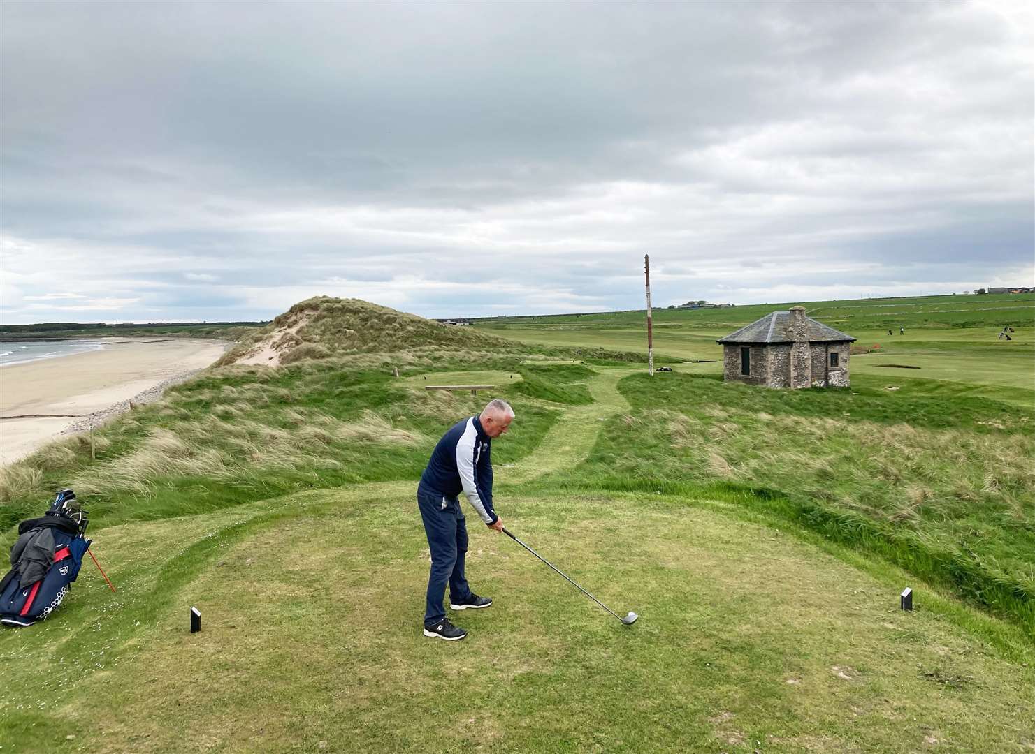 Graham Harness, round one leader of the NC500 Links Open, teeing off on the 17th hole at Wick.