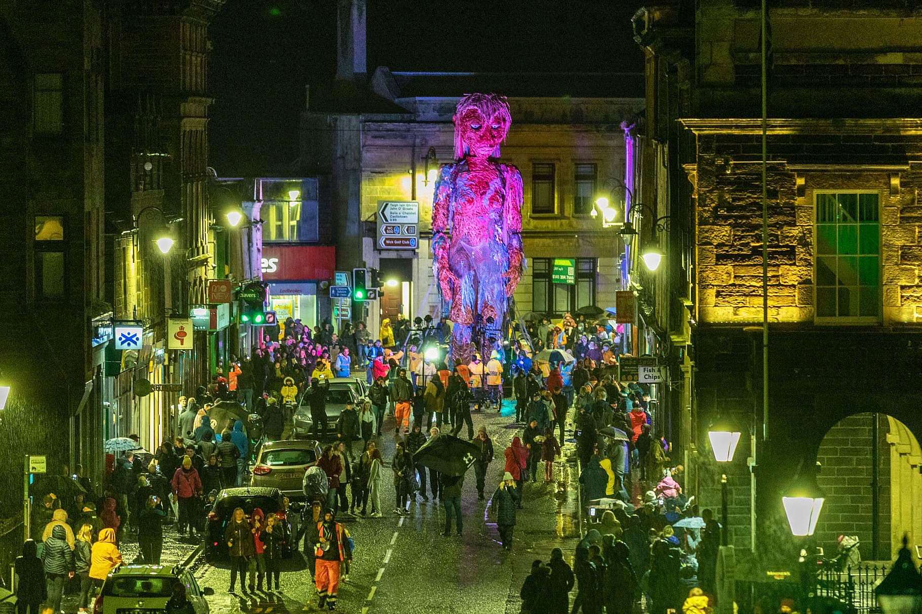 Storm the giant puppet turning into Bridge Street during her journey through Wick town centre as part of the Northern Lights Festival in October. Picture: Alan McGee