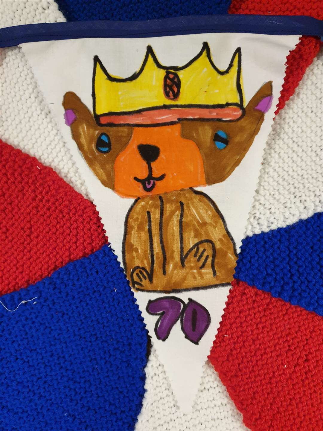 A Royal corgi complete with crown is shown in this piece of bunting