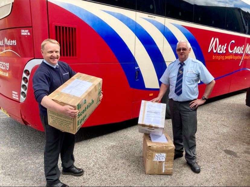 Robert Mackay senior (West Coast Motors), on the right, hands over to operations manager Russell Dodds at Oban for the forward journey to Fort William.