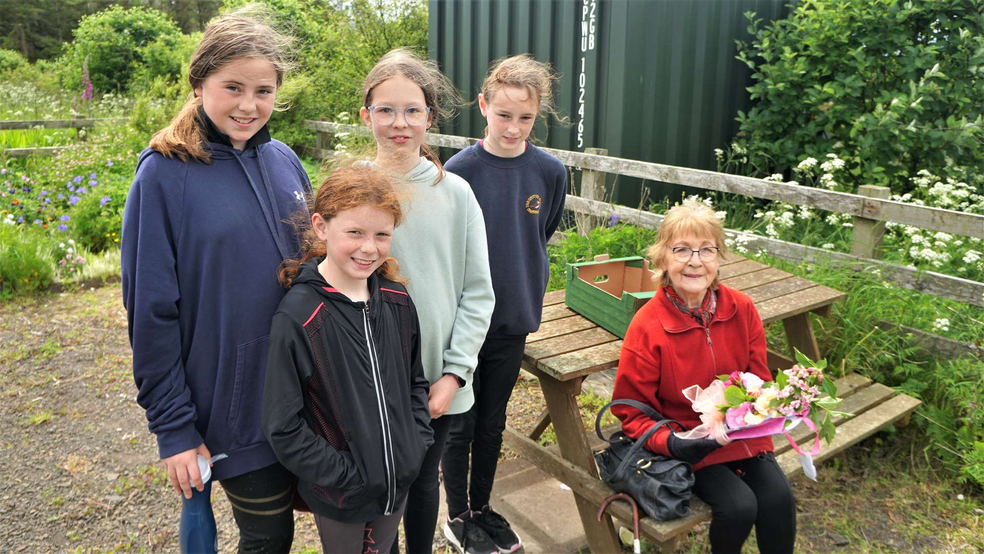 Thrumster Primary School children presented Mrs Scott with a bouquet of wildflowers. Picture: DGS
