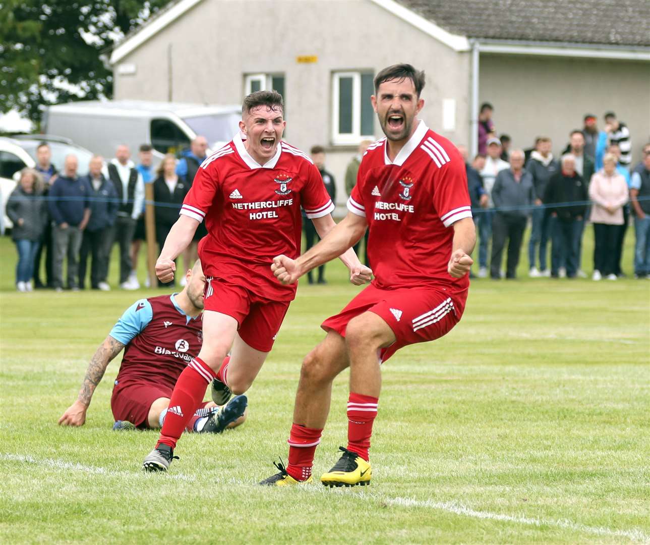 Alan Mathieson (left) celebrates with Graham MacNab after scoring the equaliser for Wick Groats in Saturday's Eain Mackintosh Cup final against Pentland United in Halkirk. The Stabbies ran out 3-1 winners. Picture: James Gunn