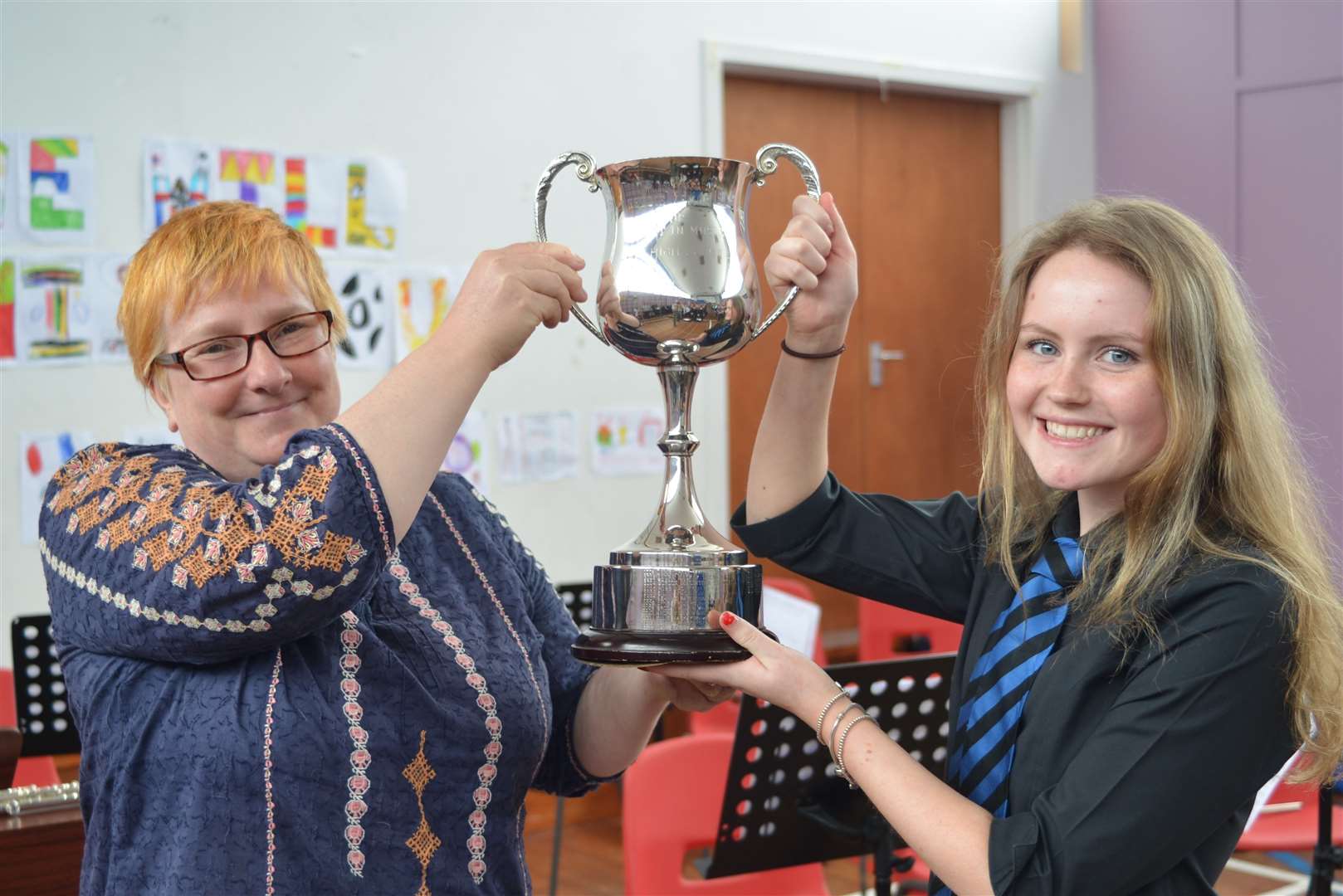 Music teacher Fenella Whittles presents Lauren Mowatt of Portskerra with the Pete Keddie Memorial Trophy for excellence in music.