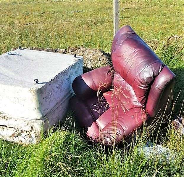 A chair, bed and other rubbish on the Hilliclay roadside is alleged to have been dumped by rogue traders.