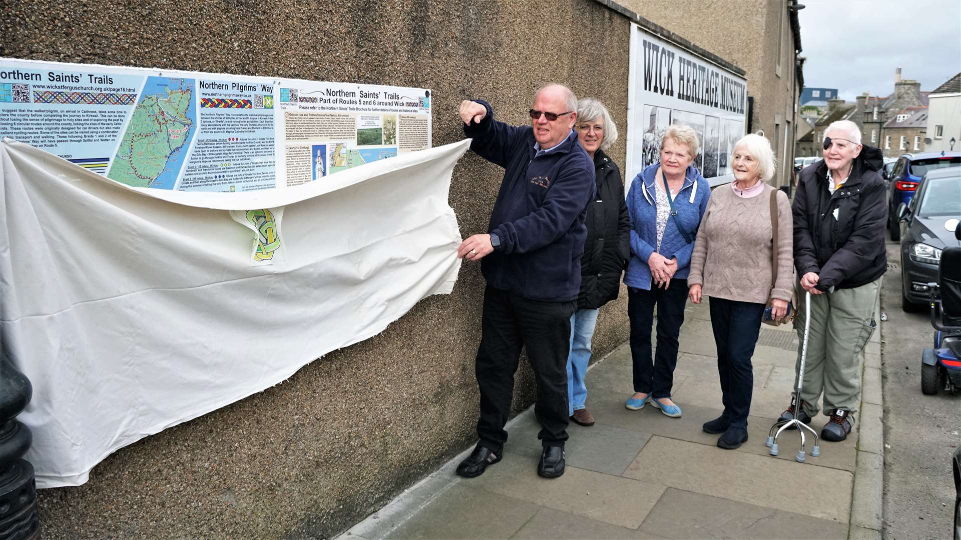 Ian Leith, trustee of Wick Heritage Museum, unveils the new panels alongside, from left, Jane Coll, Margaret Jennings, Barbara van Rooyen and Garry Robertson. Picture: DGS
