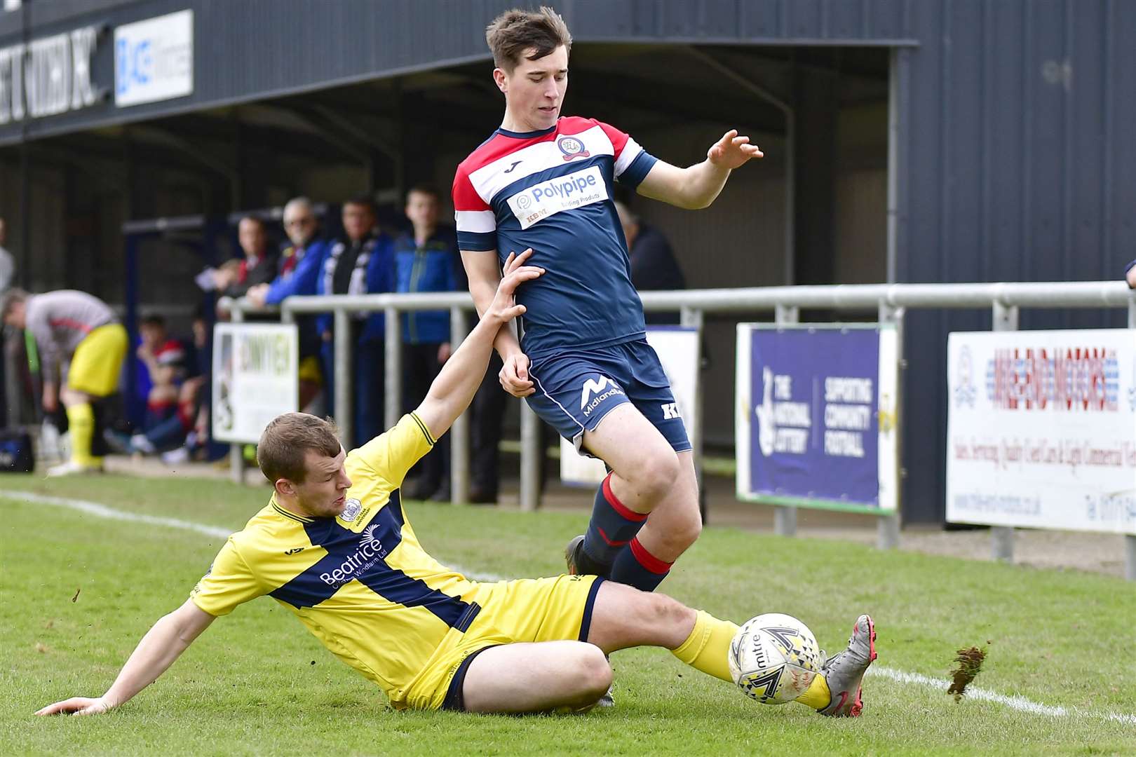 Owen Rendall of Wick Academy tackles Turriff United's Murray Cormack. Picture: Mel Roger