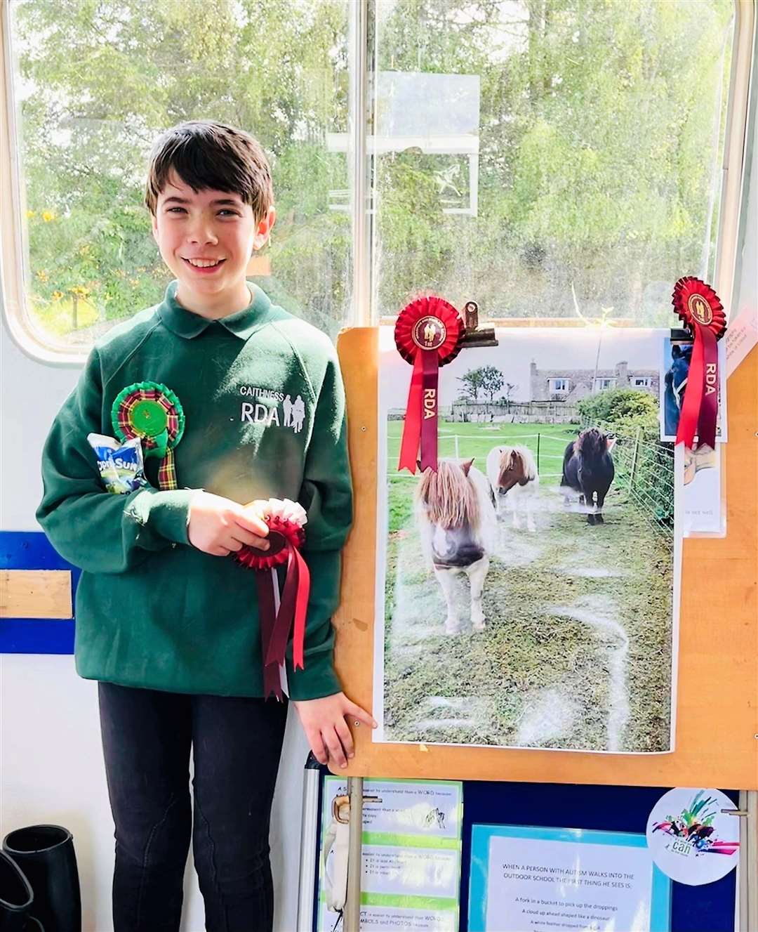 Caleb Dyer with a photo he took of his miniature Shetland ponies which he calls 'The Three Musketeers'. Caleb won first prize in the arts and crafts competition with the image.