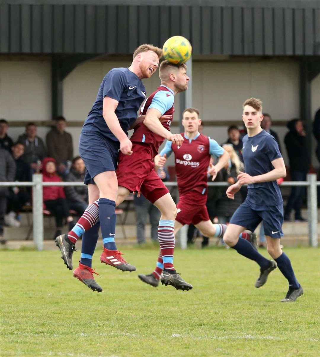 High Ormlie Hotspur defender Rob McLean in an aerial duel with Pentland United's Marc Macgregor during their Highland Amateur Cup preliminary tie last weekend. Picture: James Gunn