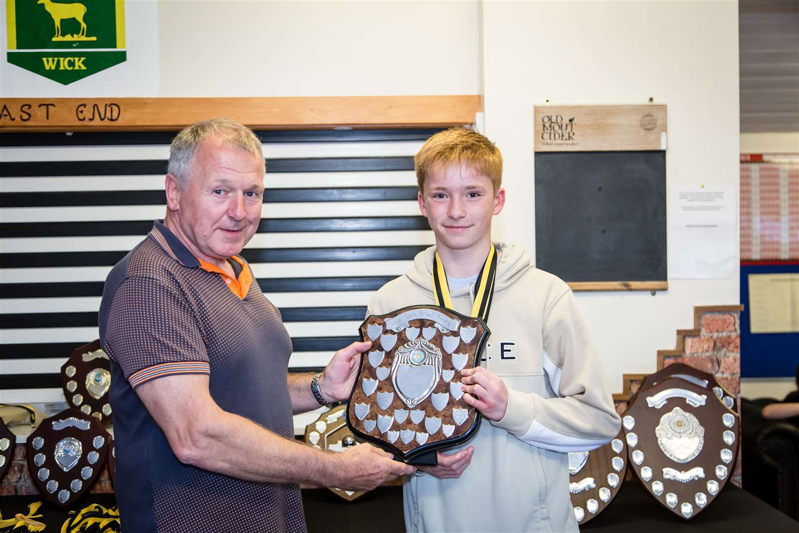 Record-breaker Joe Gill with previous chairperson Chester Henry. Picture: Alan Taylor