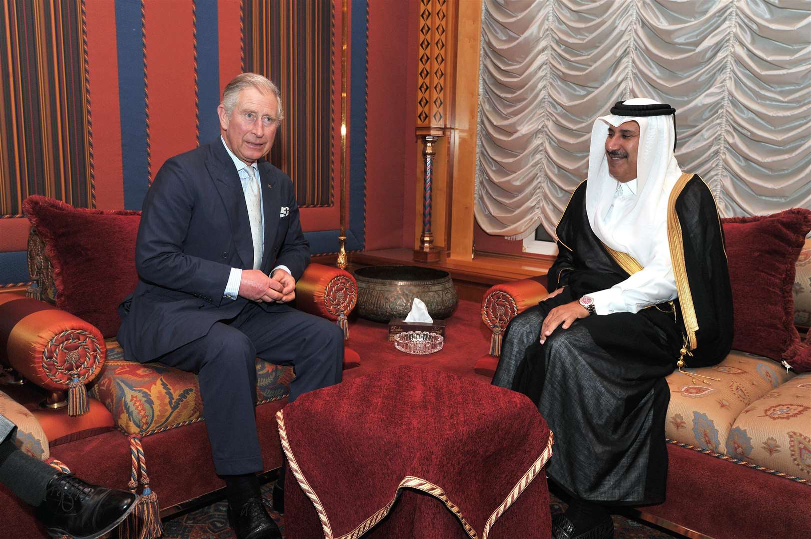 The Prince of Wales with the then Qatari prime minister Sheikh Hamad Bin Jassim in Doha in 2013 (PA)