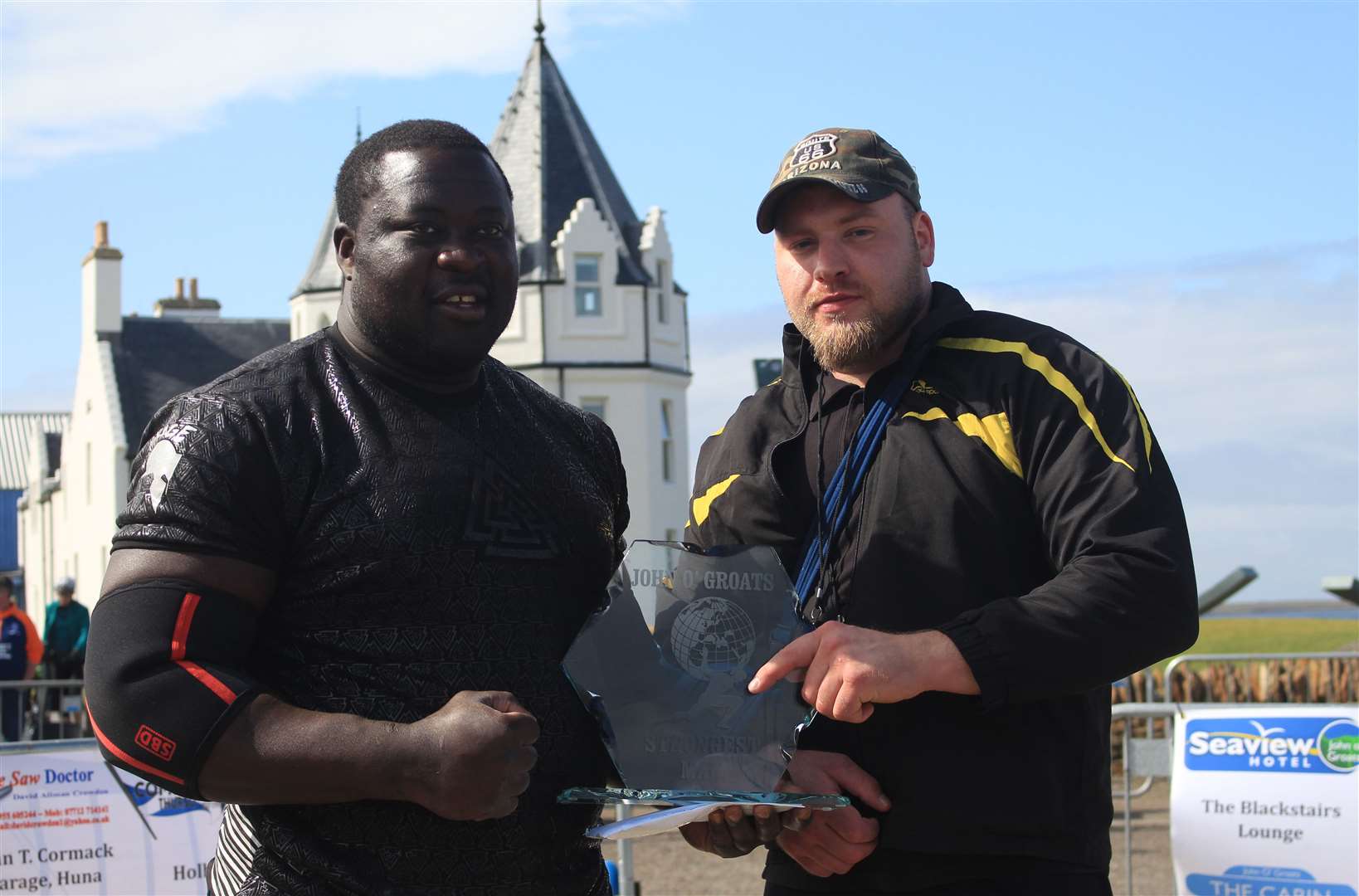 Zake Muluzi receiving his trophy from event organiser Kevin Macgregor. Picture: Alan Hendry