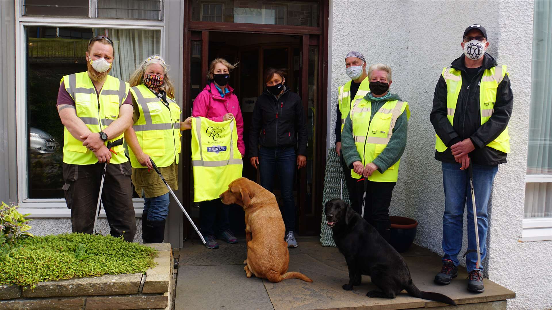 The beach cleaners get their hi-vis jackets as sponsorship from Mackays Hotel in Wick last Year. Picture: DGS