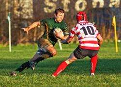 Evan Sutherland tries to surge past the Orkney standoff during the game on Saturday. Photo: www.jamesgunn.co.uk