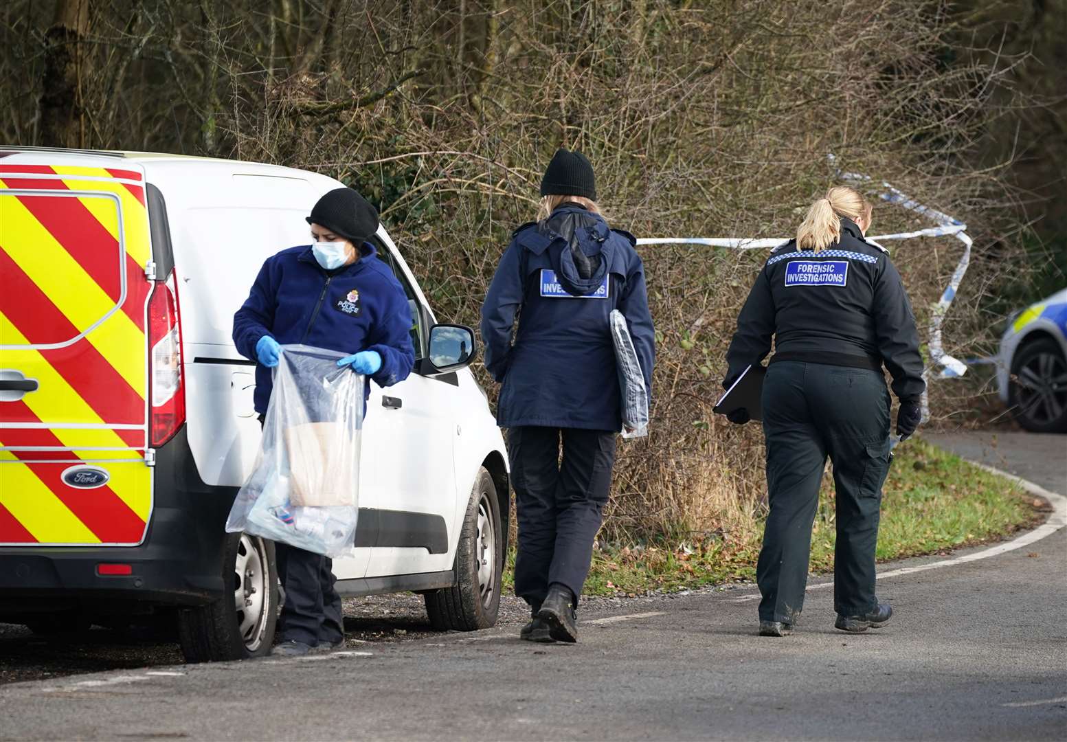 Police at Gravelly Hill in Caterham (Yui Mok/PA)