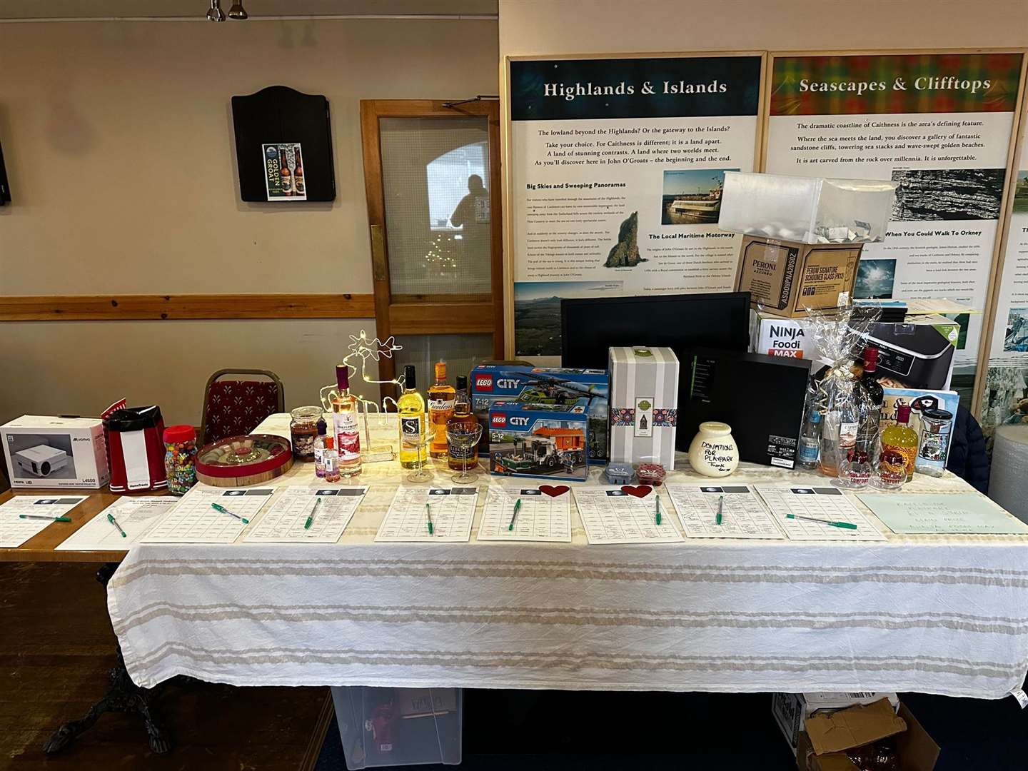 The John O'Groats Playpark fundraising table where the biggest draw was the Ninja air fryer raffle.