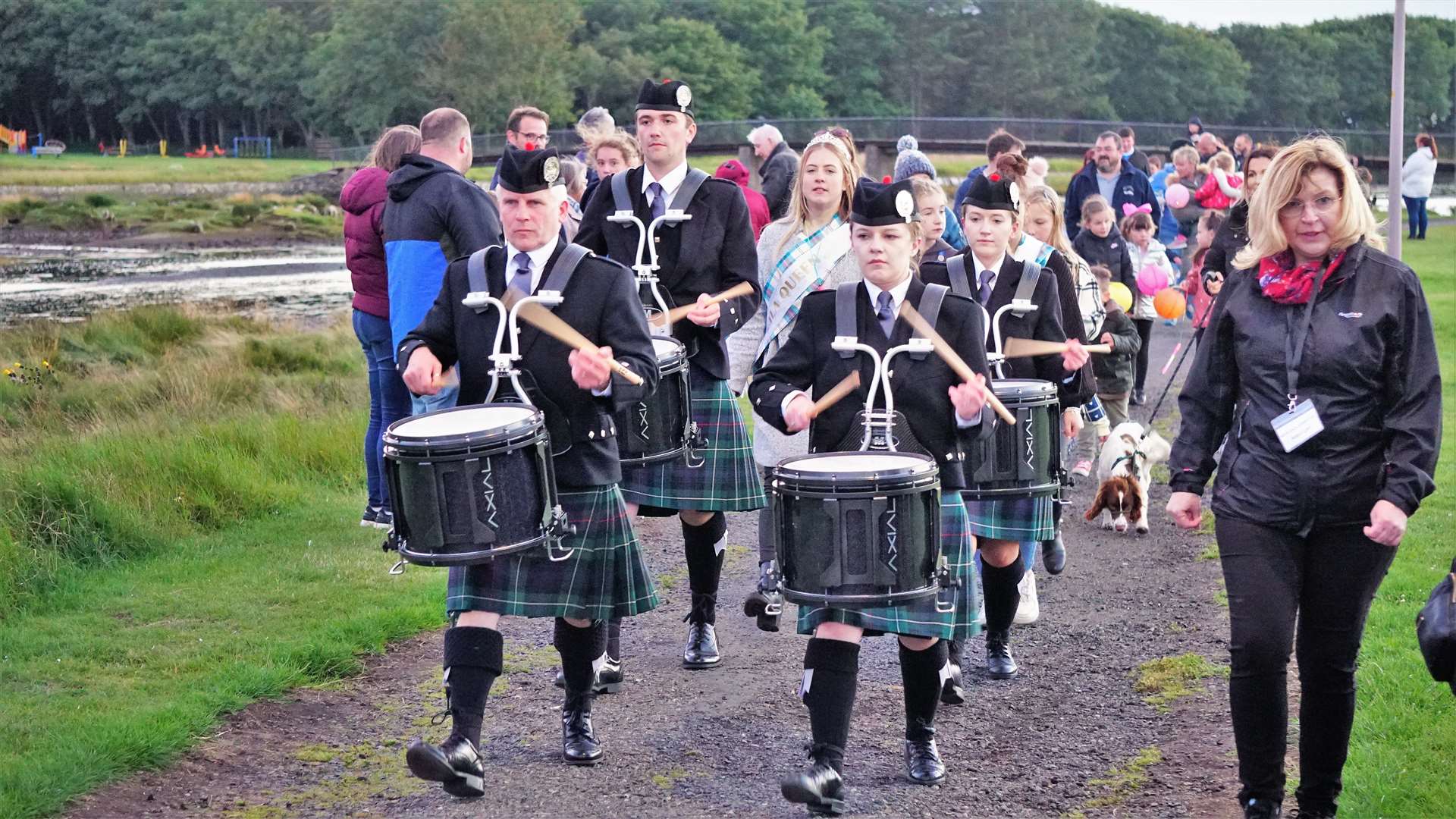 Wick pipe band drummers lead the way as the procession nears its end. Picture: DGS