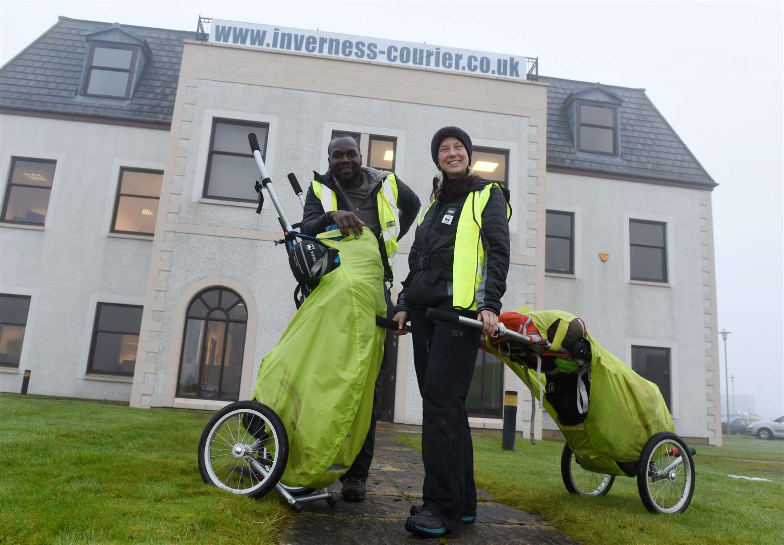 Phoebe Smith and Dwayne Fields stopped at the Inverness Courier's former home on their 1,300km hike across Britain from Dunnet Head Scotland to Lizard Point, Cornwall. Picture: Callum Mackay.