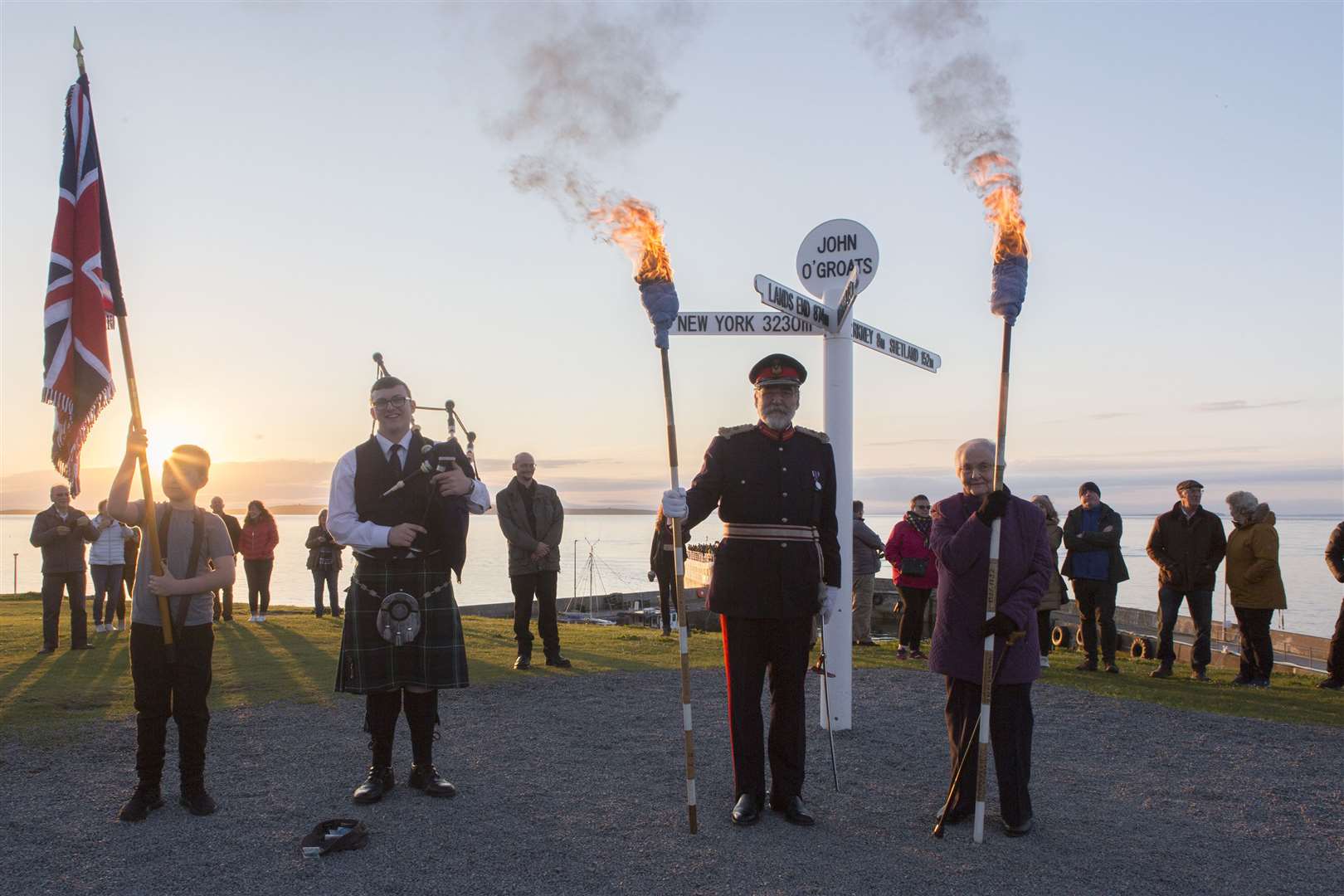Standard-bearer Hayden Davidson and piper Lewis MacLeod along with Lord Thurso and Nellie Manson before they set off on the march to the jubilee beacon. Picture: Robert MacDonald / Northern Studios