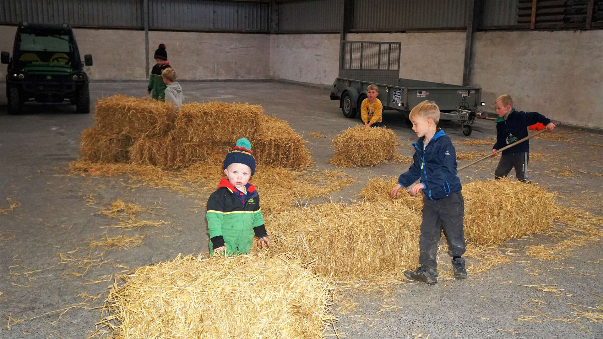 Young farmers play around bales of straw as the results are being tallied up. Picture: DGS