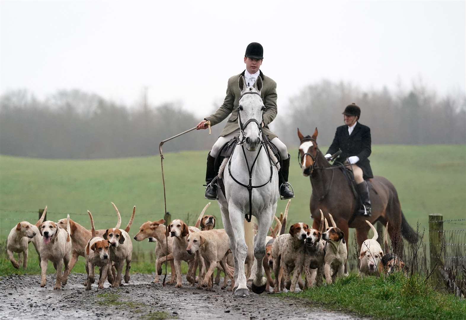One of the hunt’s masters Conrad Jones leading the way with the hounds (Andrew Milligan/PA)