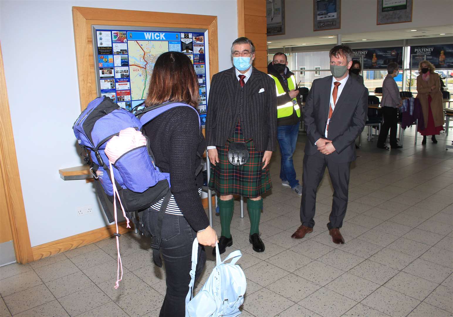 Lord Thurso and HIAL's north airports general manager Dougie Cook welcoming travellers as they arrive from Aberdeen. Picture: Alan Hendry