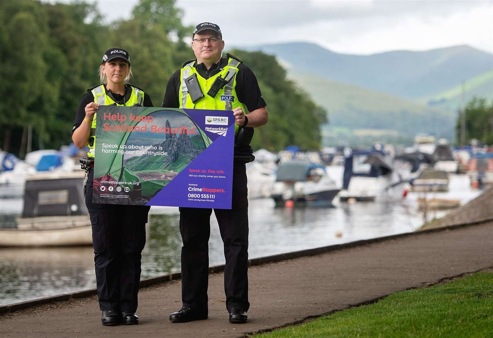 From left, PC Galbraith and PC Hardie in Balloch to launch a campaign urging Scots to speak up about those harming the countryside.