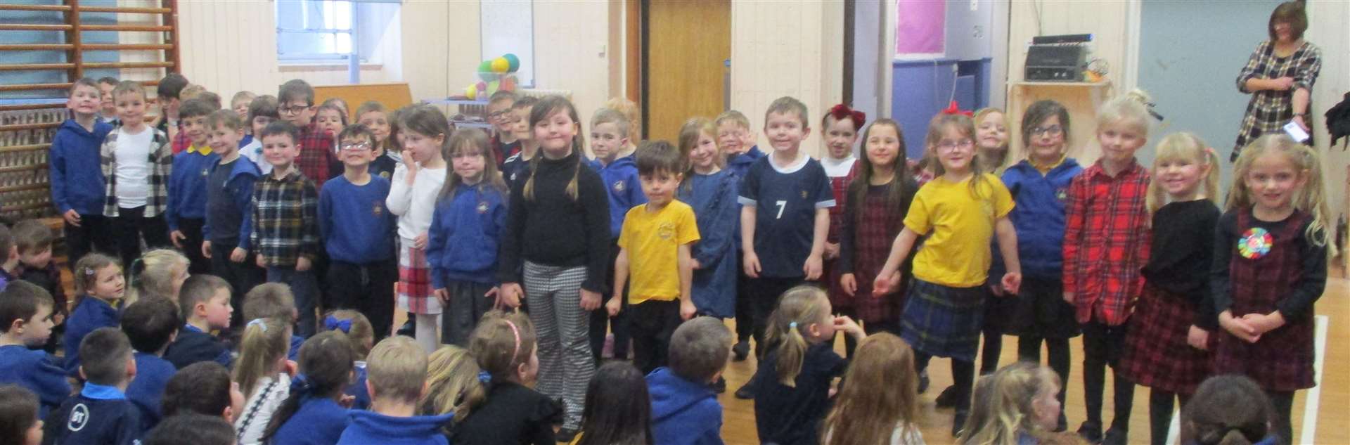 Primary 1 children who sang Three Craws with actions.