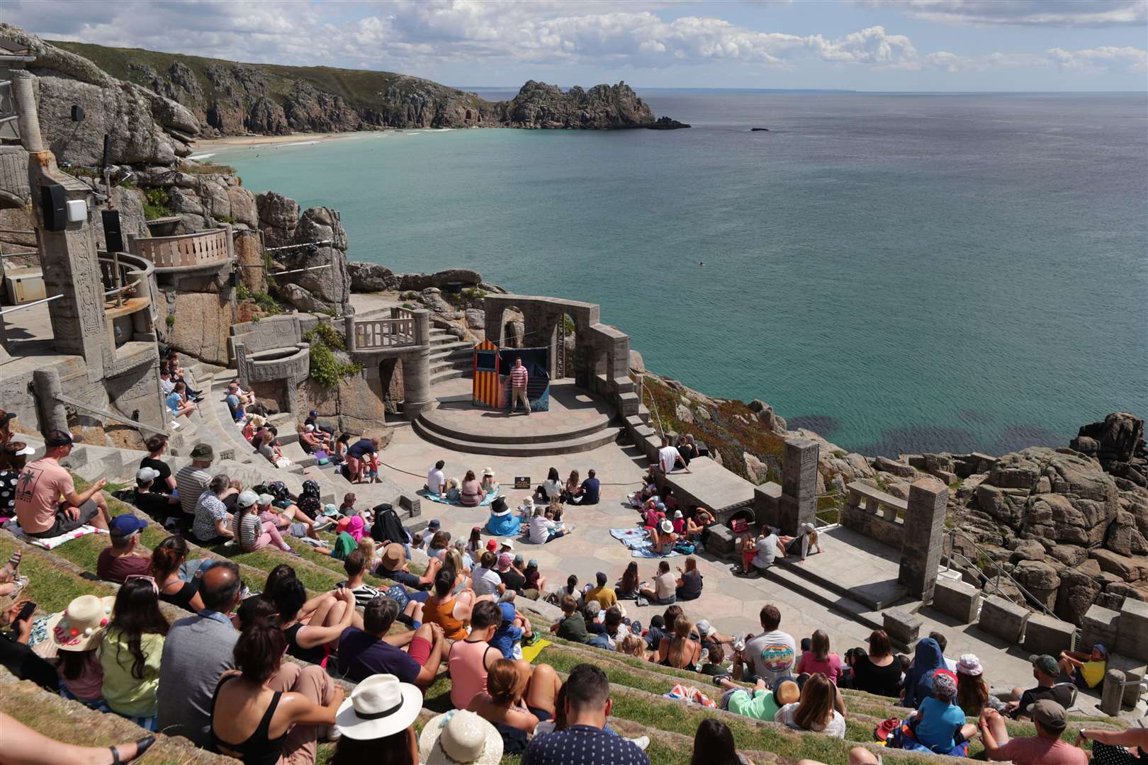 An audience enjoys the Sea Show performance at the Minack Theatre in Porthcurno near Lands End, on August 3 (David Davies/PA)