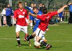 Strathspey Thistle’s Matteusz Bobrowski is closed down by the Wick defence on Saturday. Photo: Frances Porter.