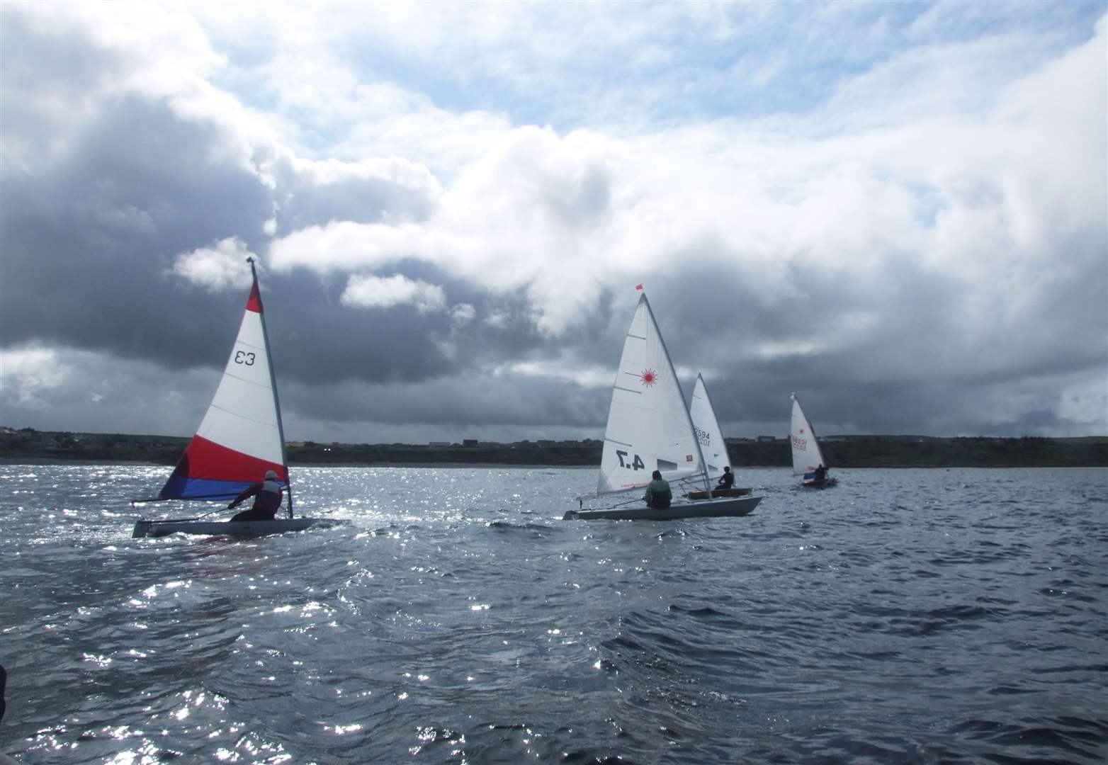 The Toppers and Lasers at the start of the second race last weekend.
