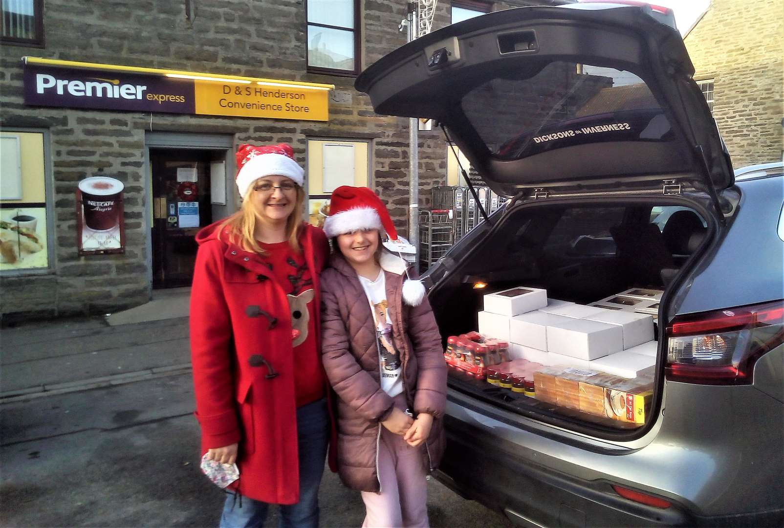 Sonya Henderson with her daughter Emily outside their convenience store in Lybster. The car is loaded with afternoon tea hampers and ready to roll.