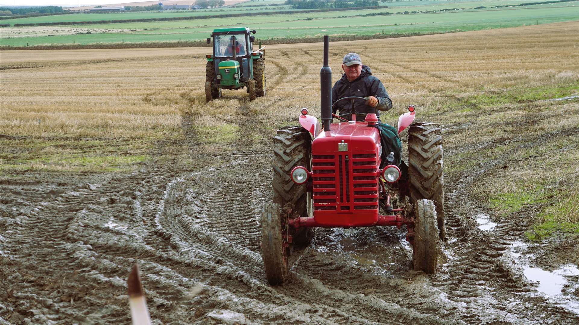 Leaving the field at last year's ploughing match are Jonnie Mathieson on the red tractor at front followed by Robbie Flett on his John Deere. Picture: DGS