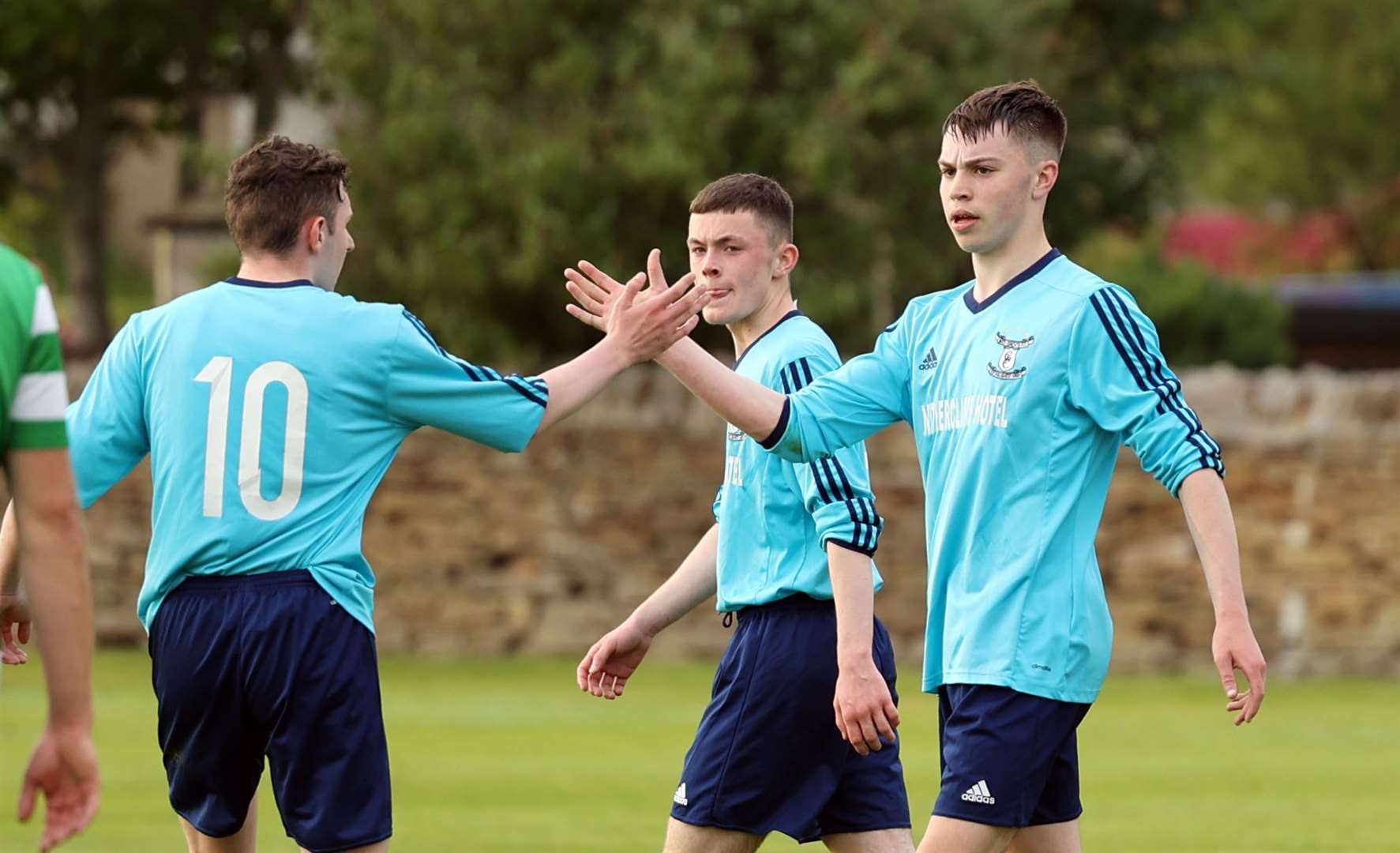 Number 10 Alan Mathieson congratulates Conor Farquhar on scoring the second goal for Wick Groats. Picture: James Gunn