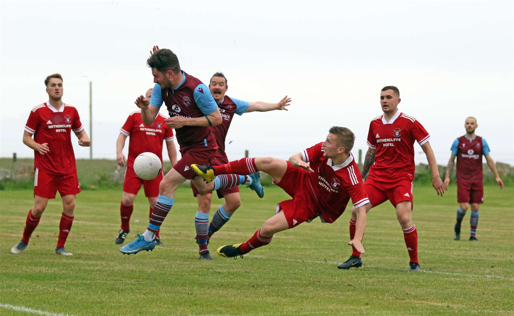 Pentland United's Conor Cormack in a tangle with Korbyn Cameron of Wick Groats. Picture: James Gunn