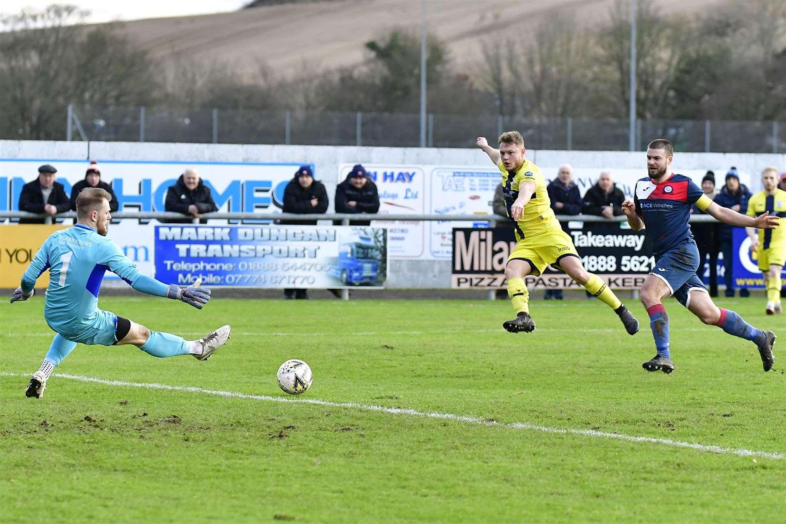 Jack Halliday finishes off a superbly worked move as he fires the ball past Turriff keeper Fraser Hobday to open the scoring for Wick Academy. Picture: Mel Roger