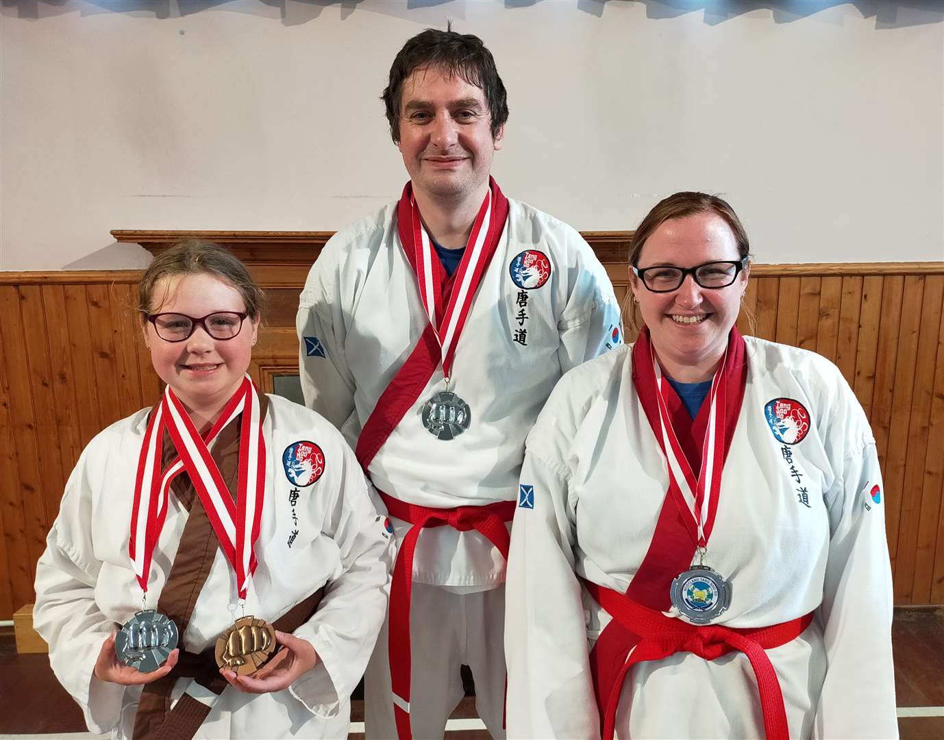 Robyn, Eoghan and Kerry with the medals they won at the recent open tournament in Elgin.